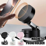 Magnetic phone holder with a hand holding a phone, showing its use on a surface.